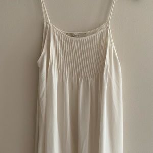 White sleeveless blouse